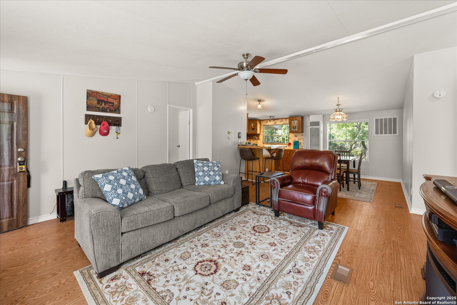 363 Elm Pass II Road East Center Point, TX 78010 - Photo 13 of 50 a living room with furniture and wooden floor