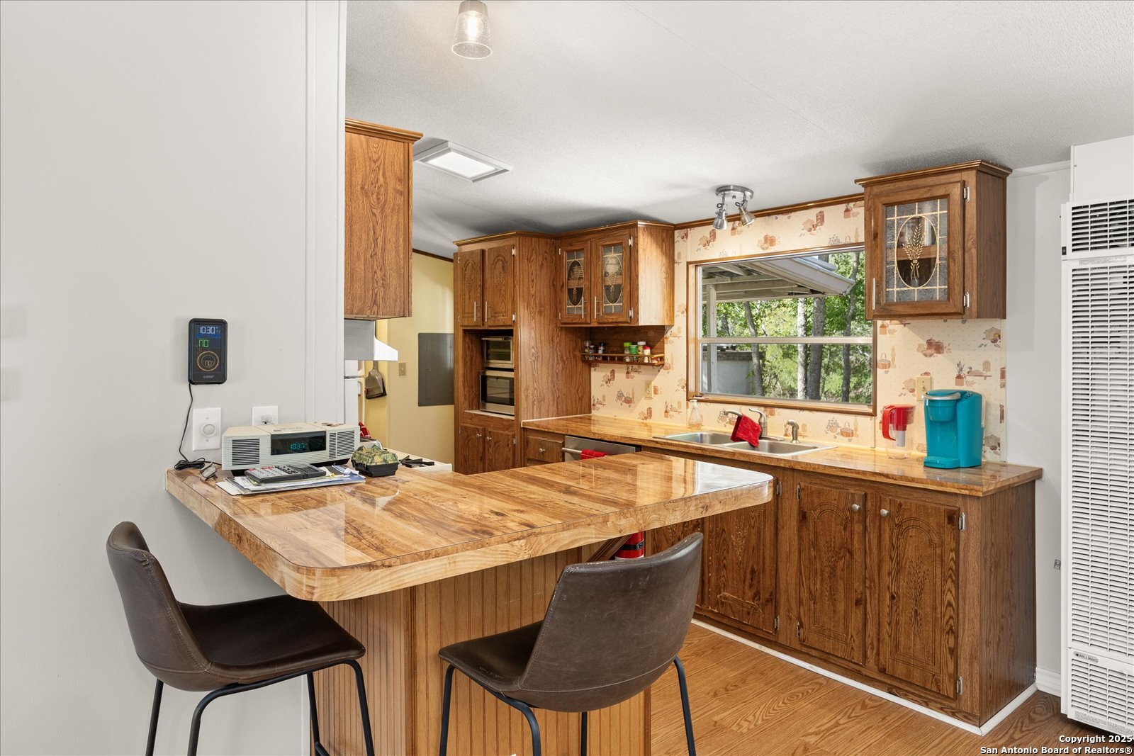 363 Elm Pass II Road East Center Point, TX 78010 - Photo 17 of 50 a dining table with chairs and window