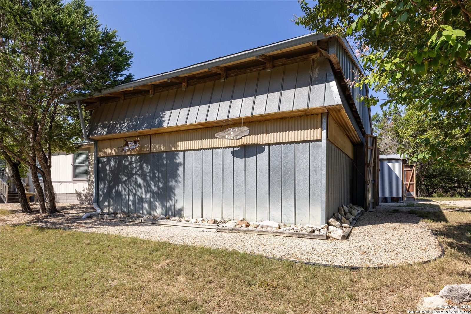 363 Elm Pass II Road East Center Point, TX 78010 - Photo 35 of 50 a view of a house with a snow on the road