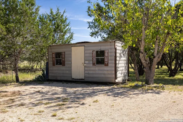 a view of a house with a tree