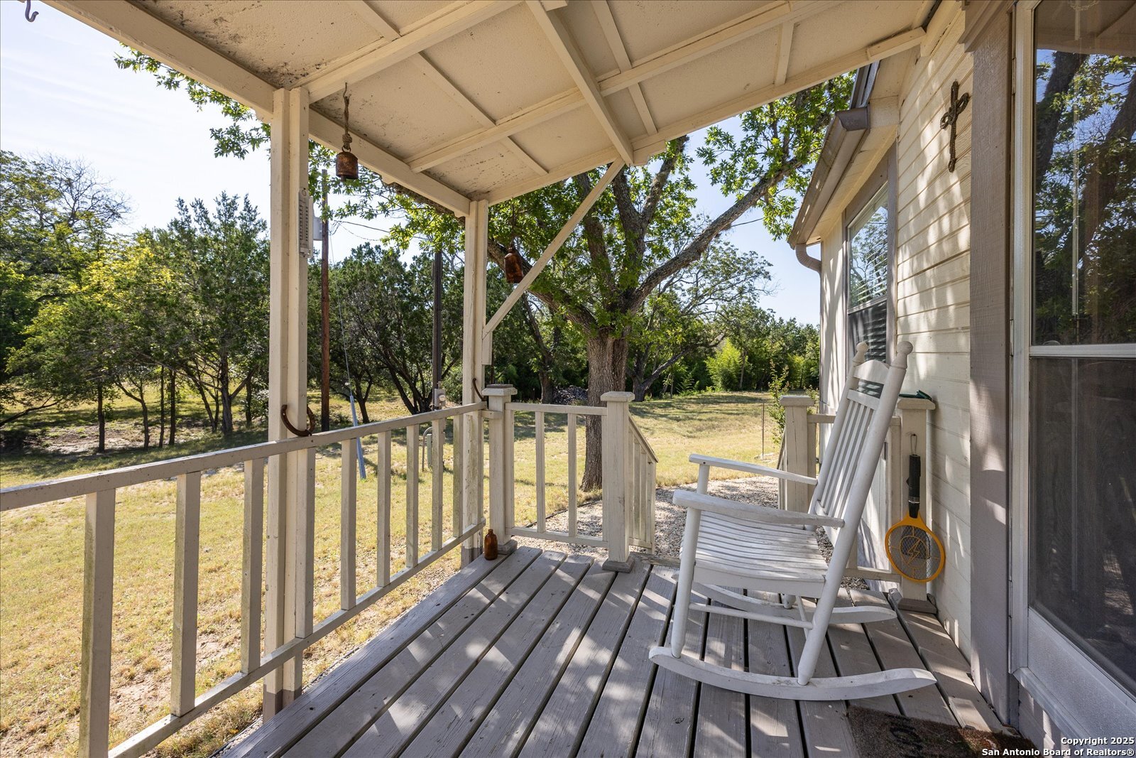 363 Elm Pass II Road East Center Point, TX 78010 - Photo 9 of 50 a view of balcony with wooden floor and outdoor seating