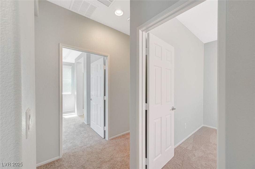 5377 Panaca Spring Street Las Vegas, NV 89122 - Photo 25 of 59 Corridor featuring light carpet and recessed lighting