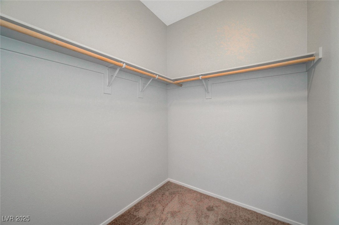 5377 Panaca Spring Street Las Vegas, NV 89122 - Photo 41 of 59 Walk in closet with carpet floors