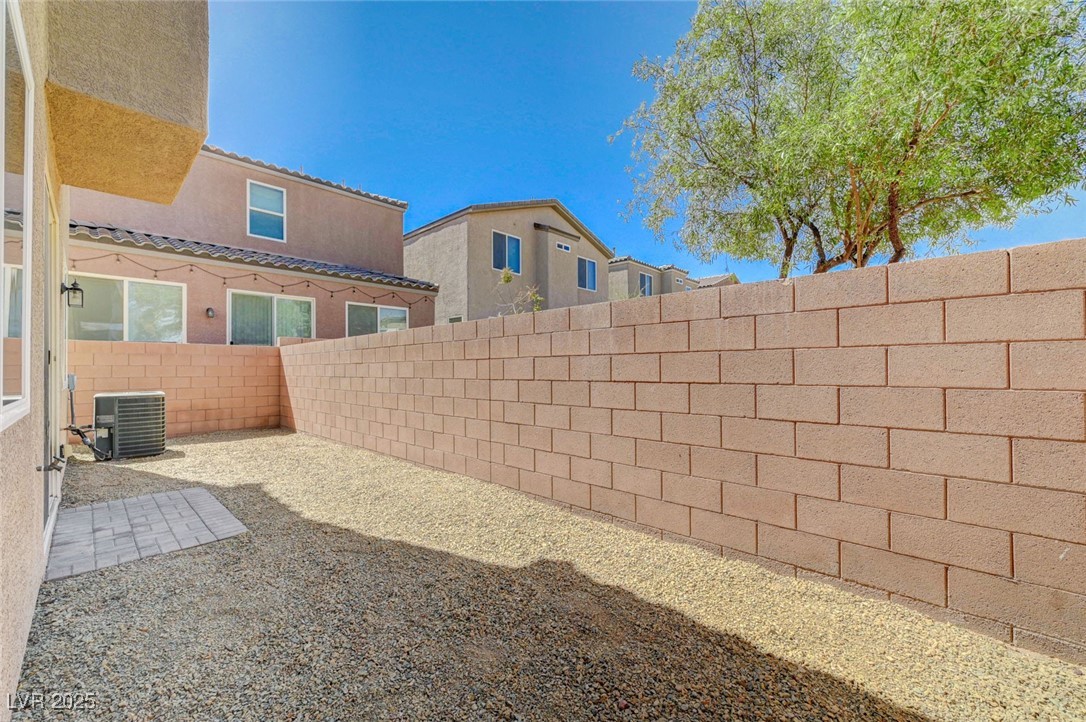 5377 Panaca Spring Street Las Vegas, NV 89122 - Photo 47 of 59 Fenced backyard with a patio area and a residential view