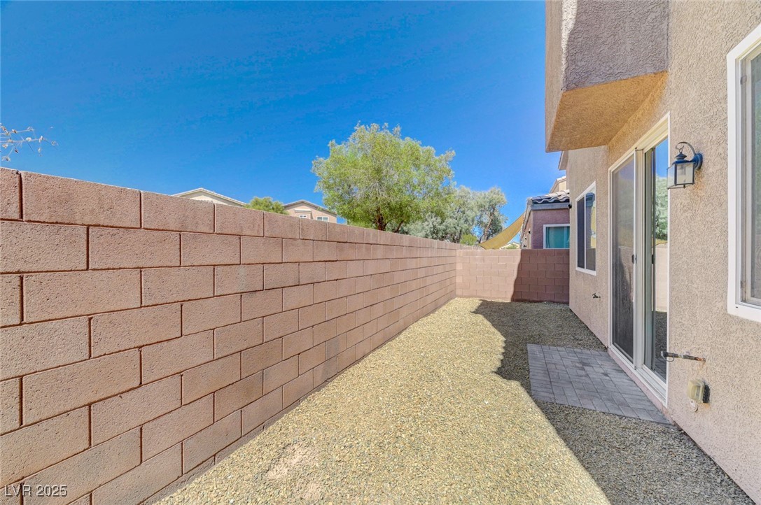 5377 Panaca Spring Street Las Vegas, NV 89122 - Photo 49 of 59 Fenced backyard with a patio area