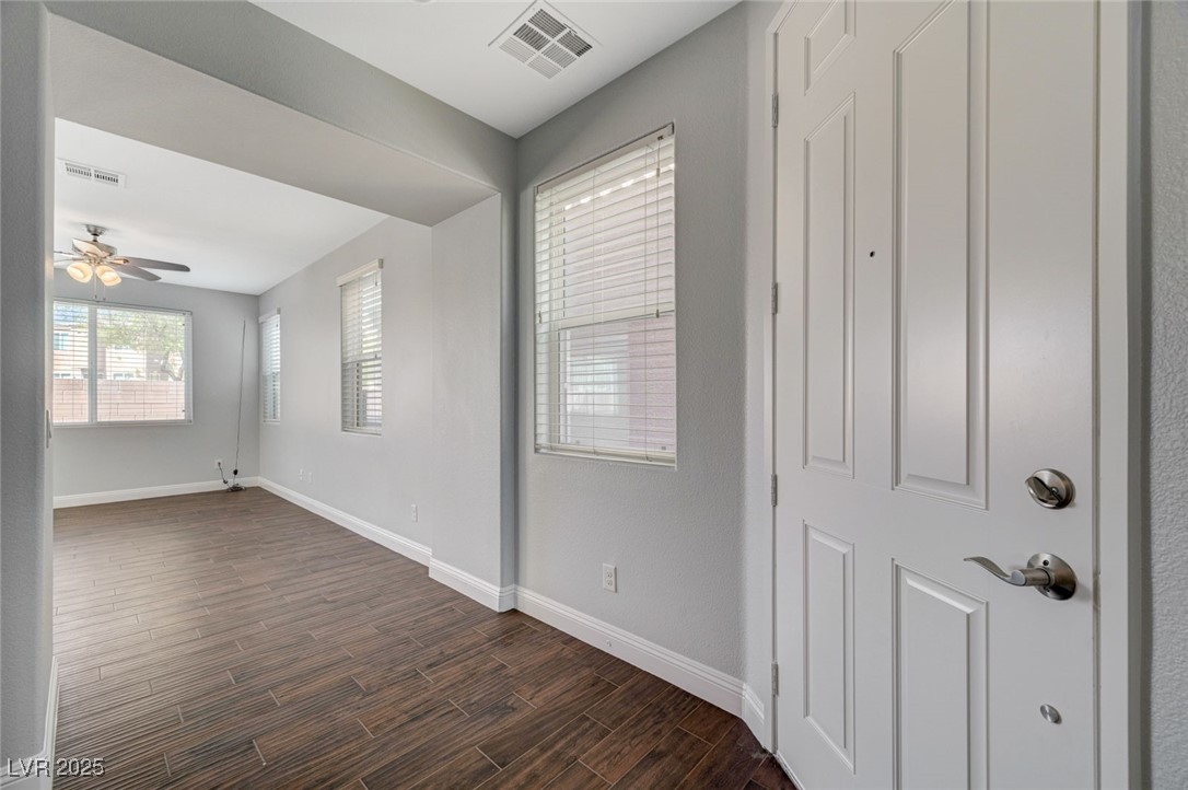 5377 Panaca Spring Street Las Vegas, NV 89122 - Photo 8 of 59 Foyer with dark wood-style floors and a ceiling fan