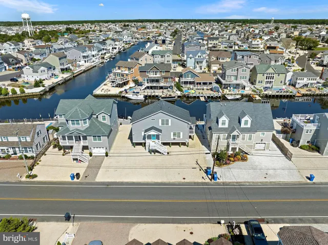 a view of multiple houses with yard