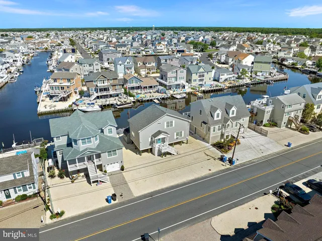 a view of a kitchen with wooden floor and a kitchen