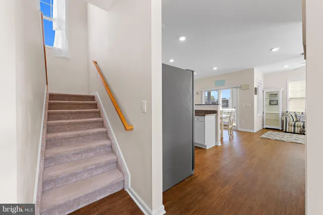 a kitchen with stainless steel appliances granite countertop a sink stove top oven and cabinets