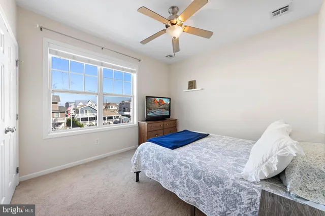 a view of a lake with outdoor seating