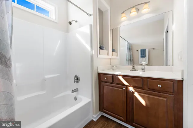 a aerial view of a house with swimming pool and a yard