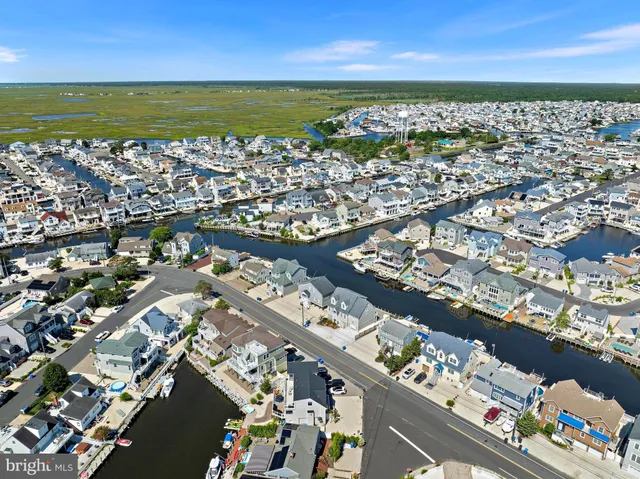 an aerial view of a city with ocean view
