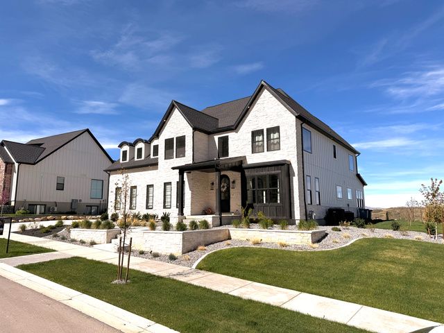 3626 Riverstone Road Mapleton, UT 84664 - Photo 2 of 58 View of the front of the home featuring stone siding, a front lawn, four fruit trees, and a covered porch