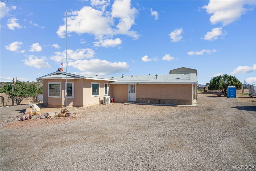 1108 South McCarrel Road Kingman, AZ 86401 - Photo 19 of 65 a view of a house with backyard and sitting area