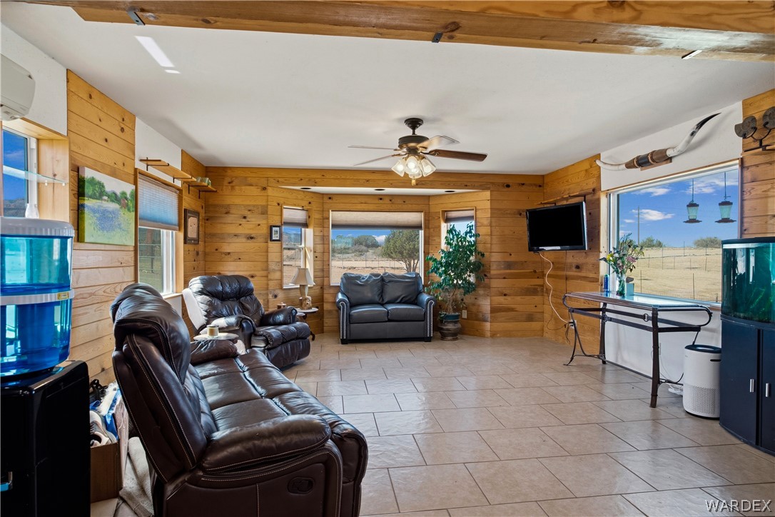 1108 South McCarrel Road Kingman, AZ 86401 - Photo 31 of 65 a living room with furniture and a flat screen tv