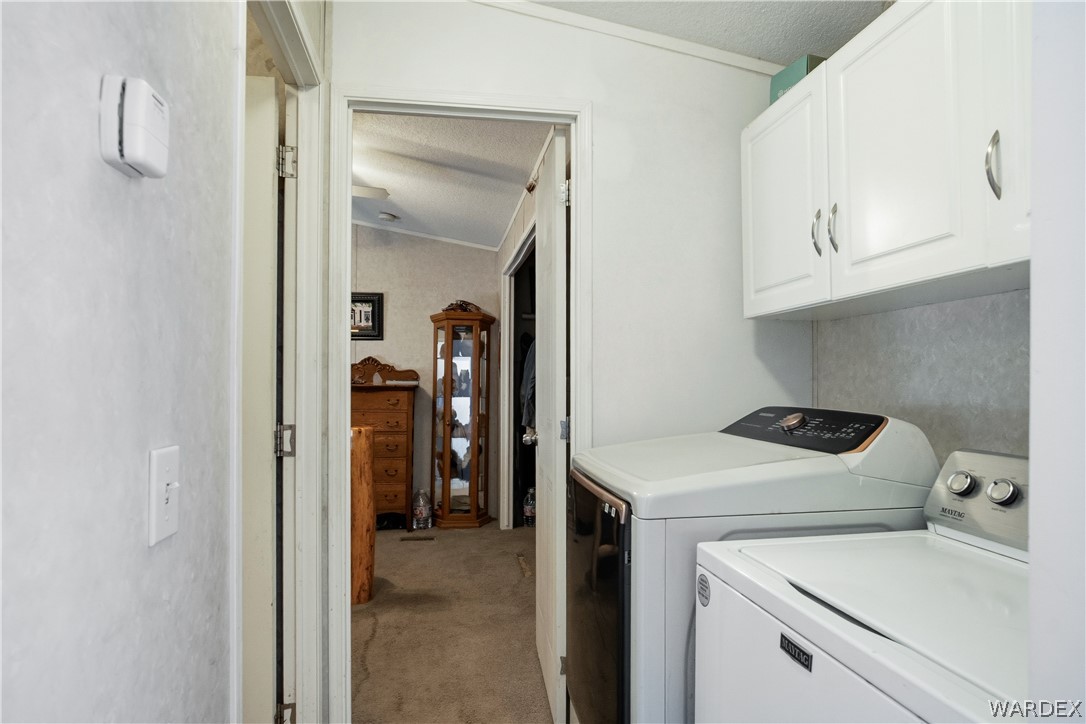 1108 South McCarrel Road Kingman, AZ 86401 - Photo 38 of 65 a utility room with dryer and washer