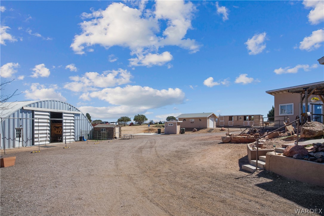 1108 South McCarrel Road Kingman, AZ 86401 - Photo 54 of 65 View of yard featuring an outbuilding