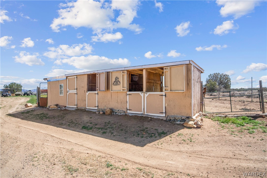 1108 South McCarrel Road Kingman, AZ 86401 - Photo 64 of 65 a front view of a house with a yard