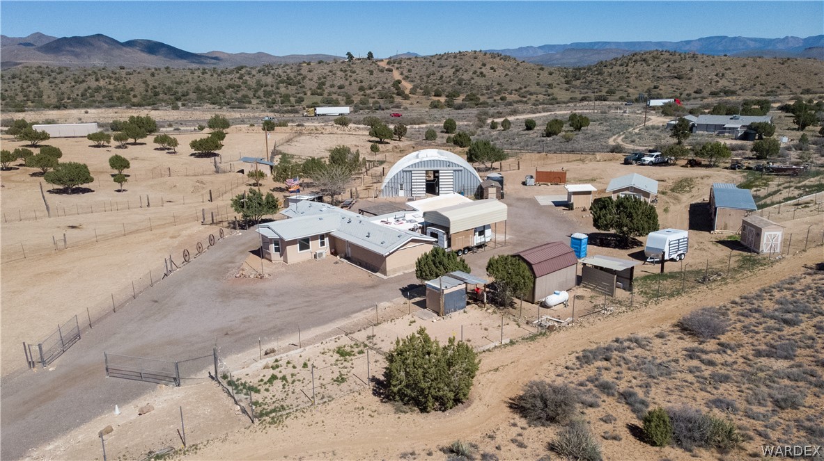 1108 South McCarrel Road Kingman, AZ 86401 - Photo 7 of 65 an aerial view of a house with a garden and mountain view