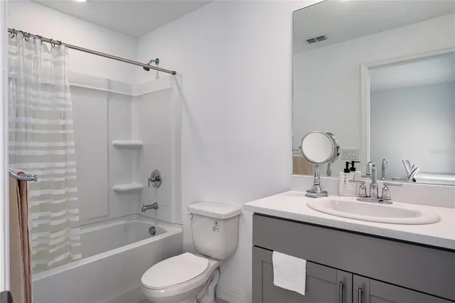 a bathroom with a sink toilet tub and shower