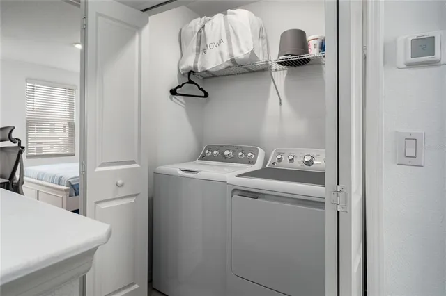 a utility room with dryer and washer