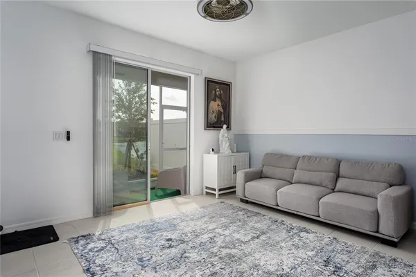 a living room with furniture and a window