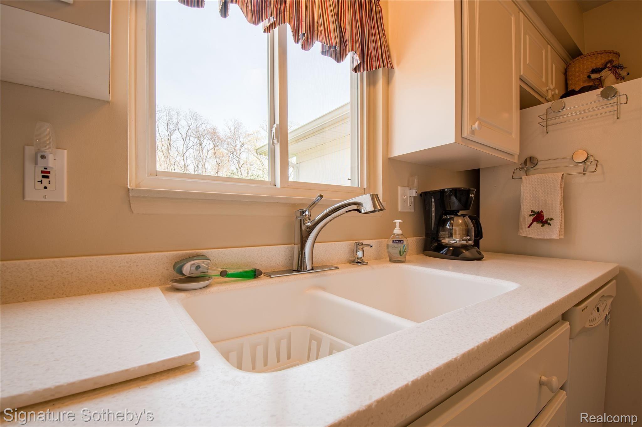 2500 South Hickory Ridge Road Milford, MI 48380 - Photo 13 of 40 Corian counters with undermount sink