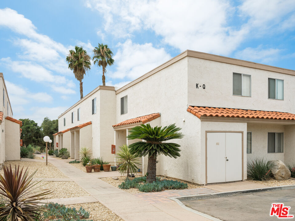 748 North 3rd Street El Cajon, CA 92021 - Photo 5 of 9 a front view of a house with a yard and garage