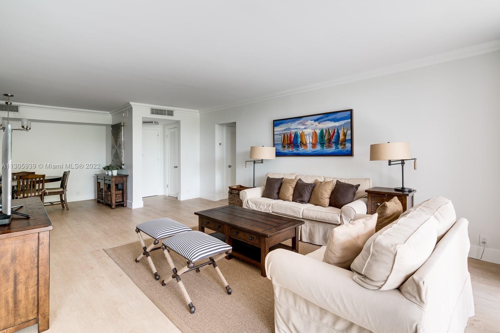 1121 Crandon Boulevard, Unit D206 Key Biscayne, FL 33149 - Photo 4 of 22 a living room with furniture