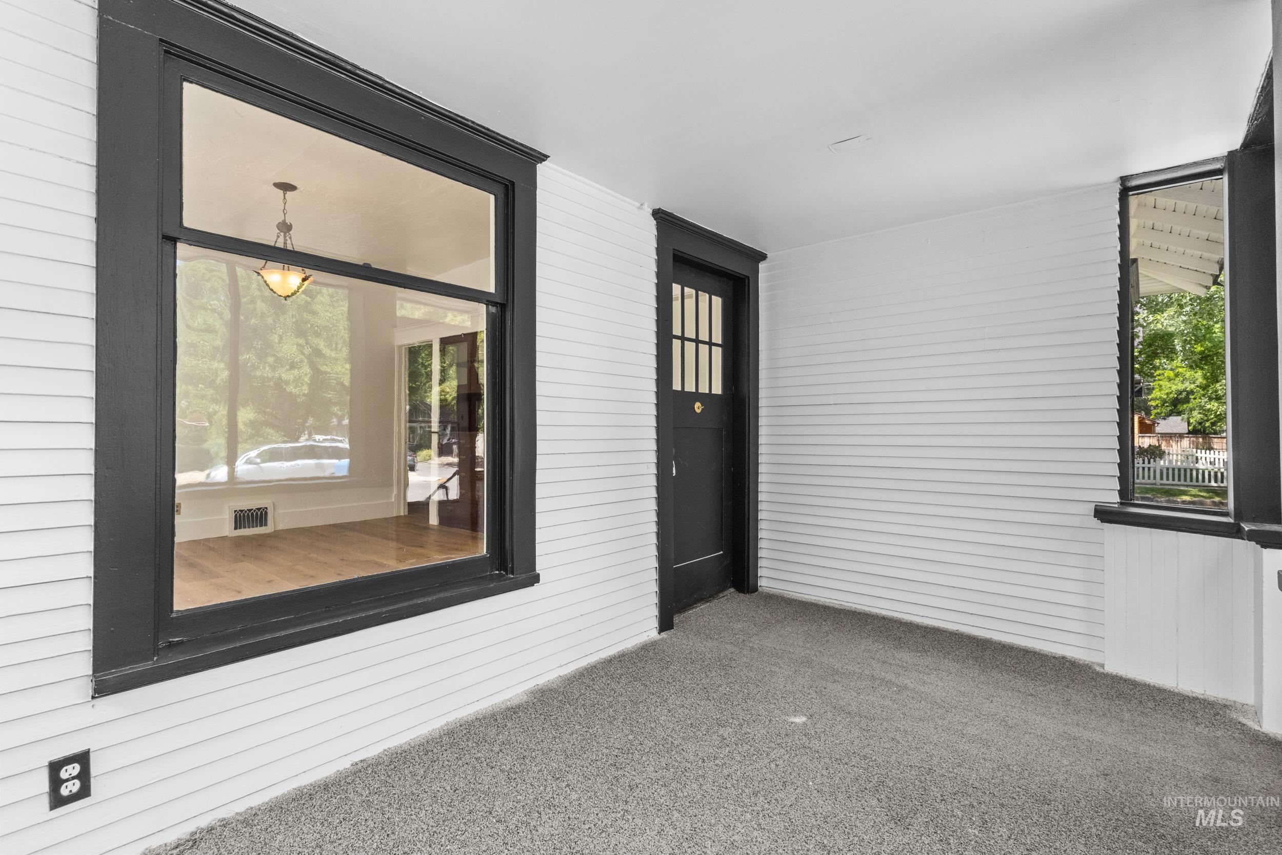 2119 West Brumback Street Boise, ID 83702 - Photo 6 of 30 Covered porch with dark-framed windows and entrance door