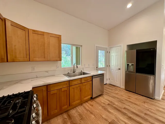 a kitchen with a sink and cabinets