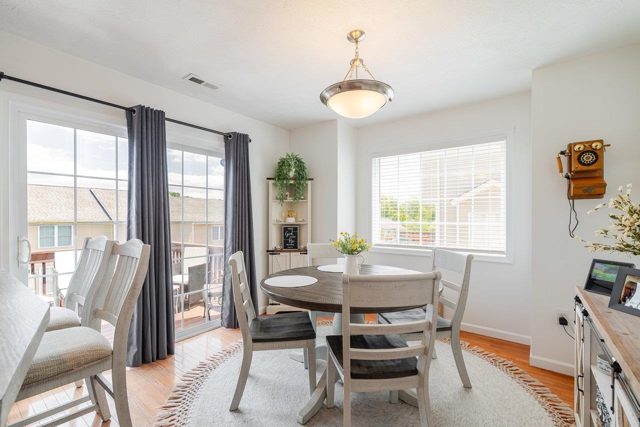 3035 Taylor Spring Lane Harrisonburg, VA 22801 - Photo 15 of 55 a view of a dining room with furniture and a potted plant