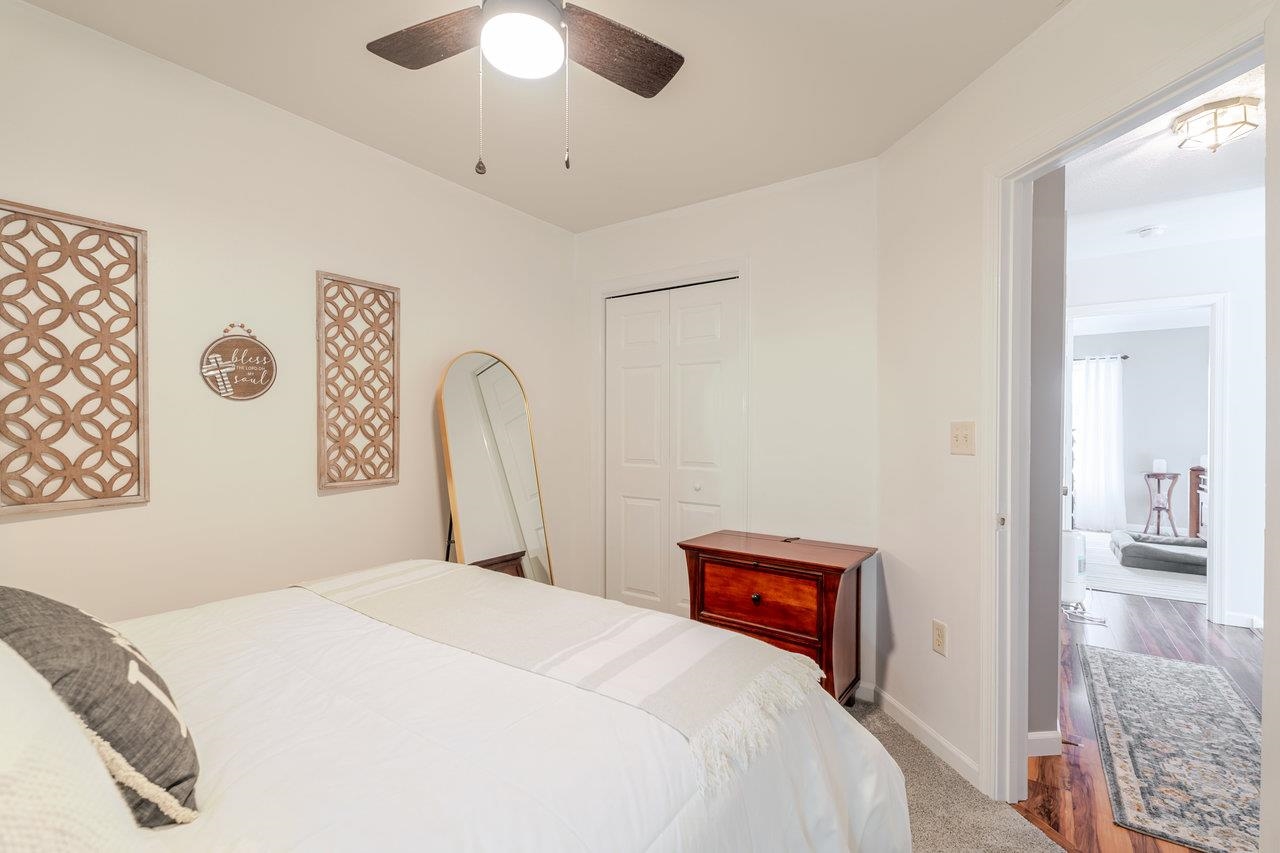 3035 Taylor Spring Lane Harrisonburg, VA 22801 - Photo 31 of 55 a bedroom with a bed and a chandelier