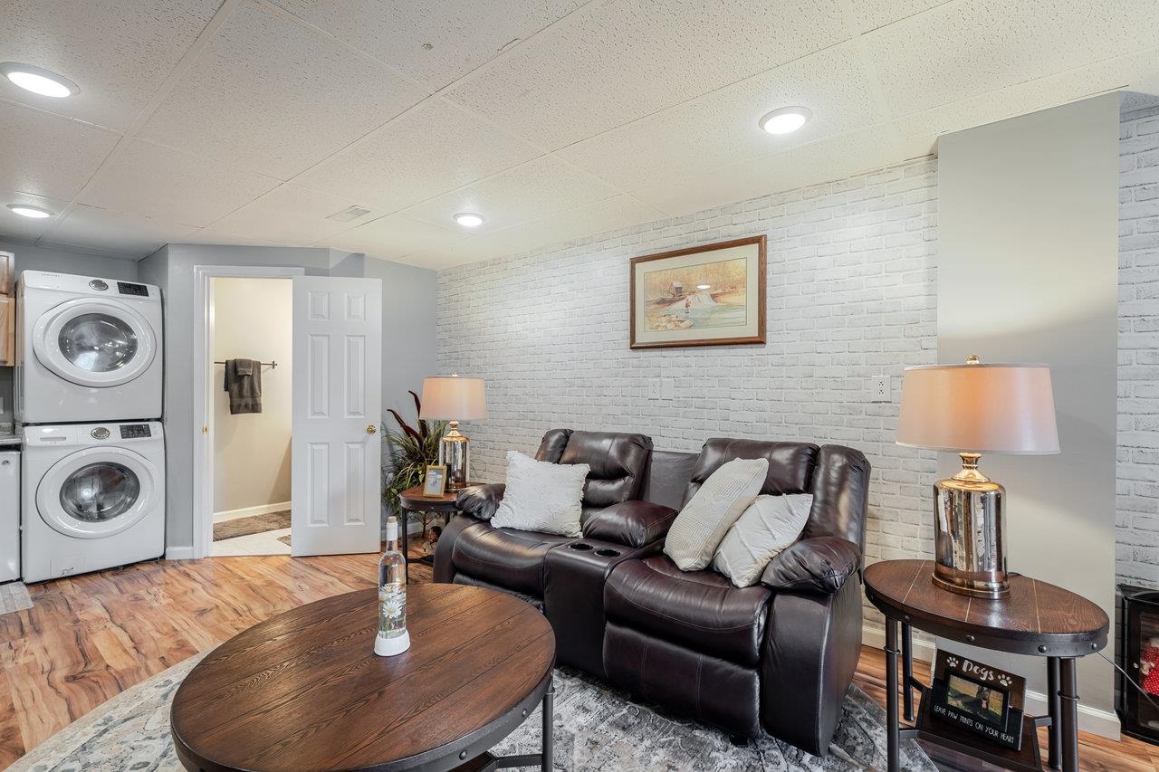 3035 Taylor Spring Lane Harrisonburg, VA 22801 - Photo 39 of 55 a living room with furniture and a lamp