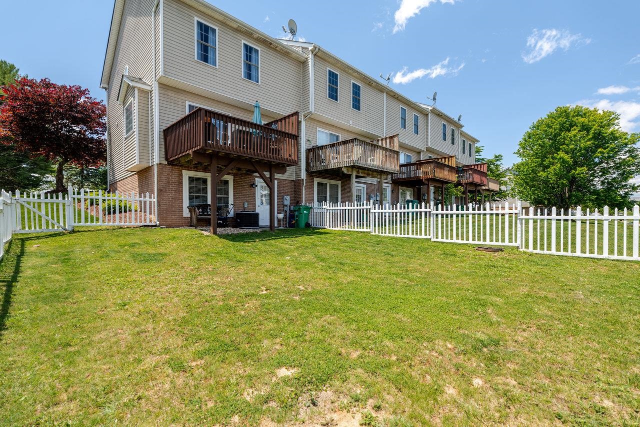 3035 Taylor Spring Lane Harrisonburg, VA 22801 - Photo 49 of 55 a front view of a house with a garden and plants