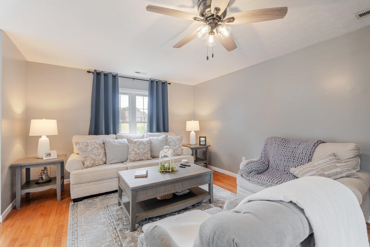 3035 Taylor Spring Lane Harrisonburg, VA 22801 - Photo 6 of 55 a living room with furniture and a chandelier