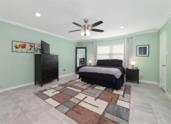 a spacious bathroom with a granite countertop sink and a mirror