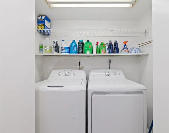 a bathroom with a granite countertop sink toilet a large mirror a shower and a bathtub