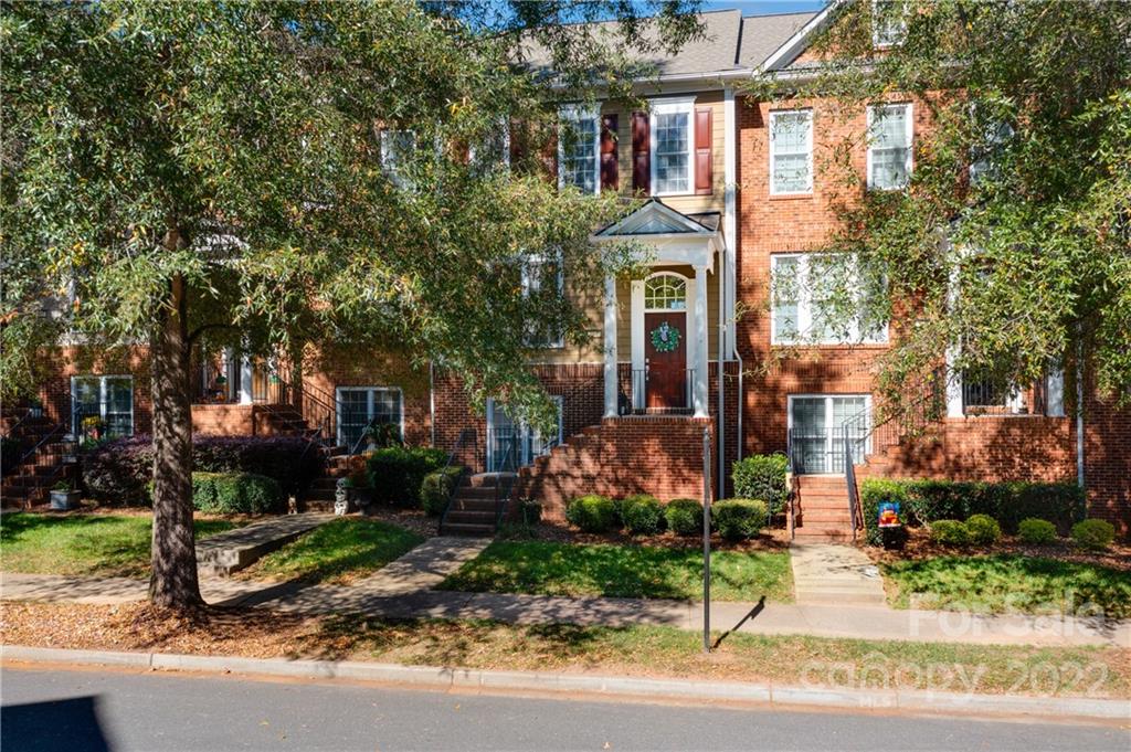 669 6th Baxter Crossing Fort Mill, SC 29708 - Photo 1 of 39 a front view of a house with a yard