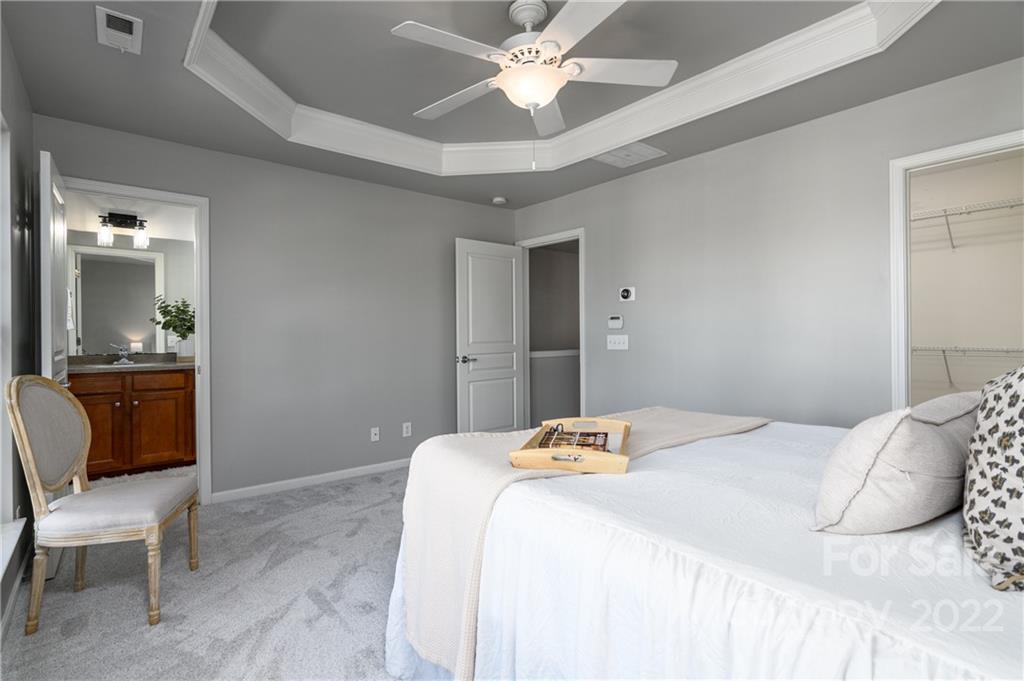 669 6th Baxter Crossing Fort Mill, SC 29708 - Photo 21 of 39 a bedroom with a bed and a chair