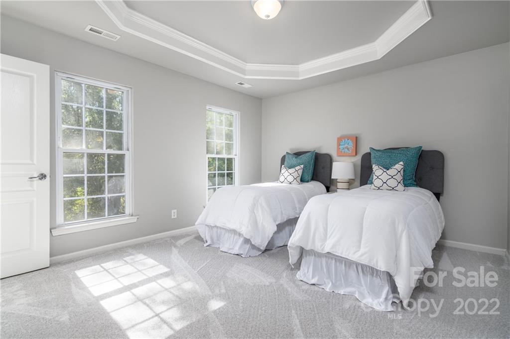 669 6th Baxter Crossing Fort Mill, SC 29708 - Photo 23 of 39 a bedroom with a bed and a window