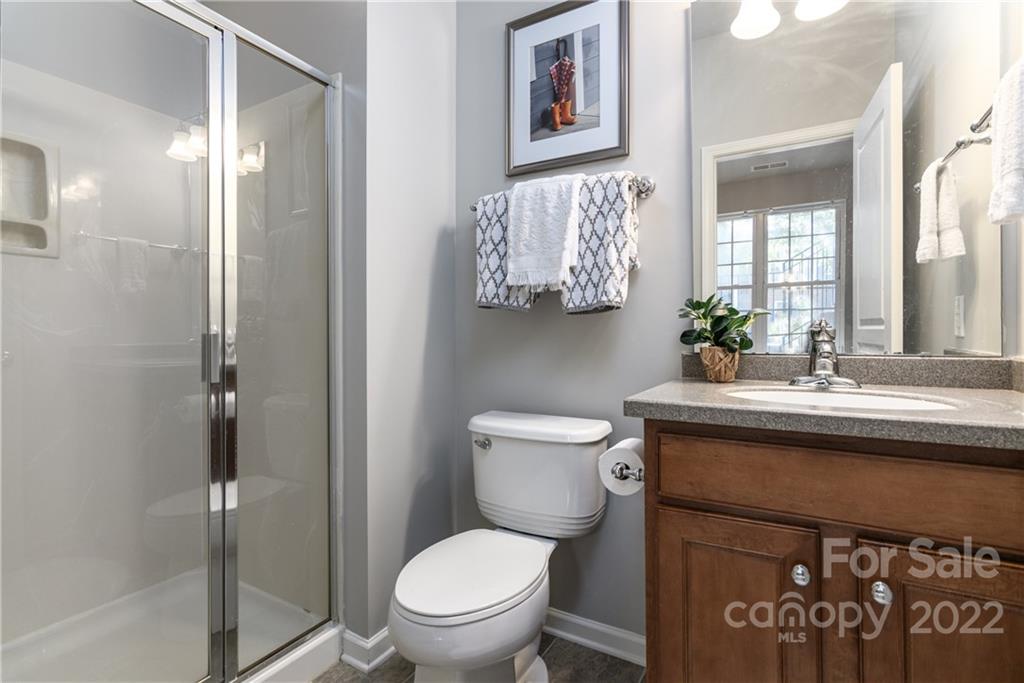 669 6th Baxter Crossing Fort Mill, SC 29708 - Photo 29 of 39 a bathroom with a toilet sink and mirror