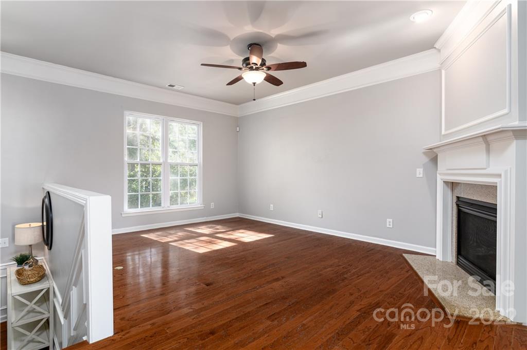 669 6th Baxter Crossing Fort Mill, SC 29708 - Photo 8 of 39 a view of an empty room with window and wooden floor