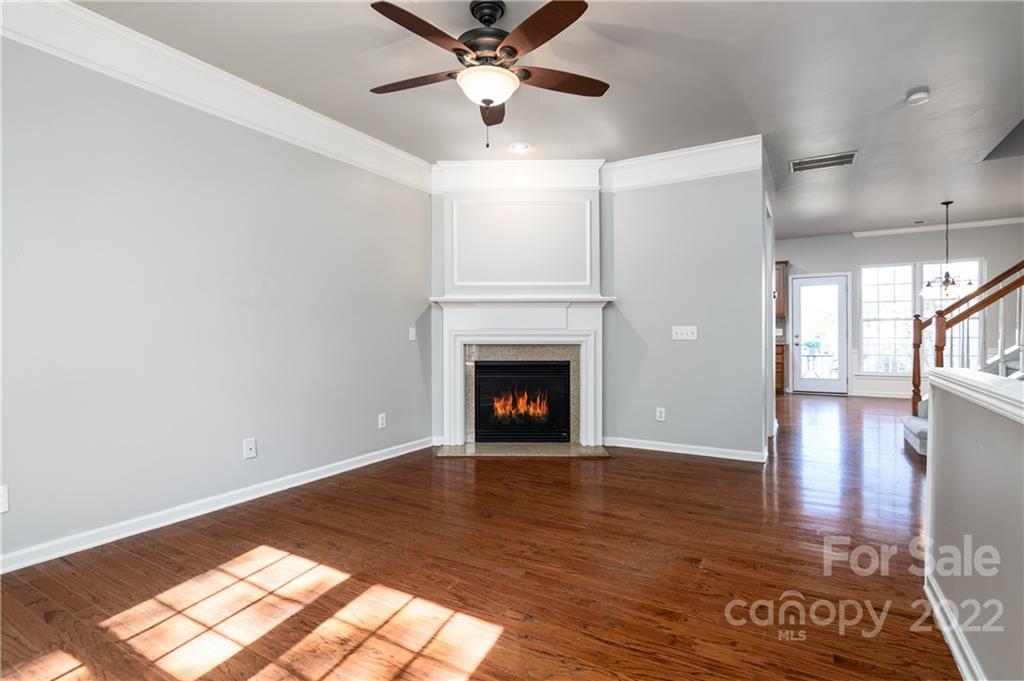 669 6th Baxter Crossing Fort Mill, SC 29708 - Photo 9 of 39 a view of empty room with wooden floor and fan