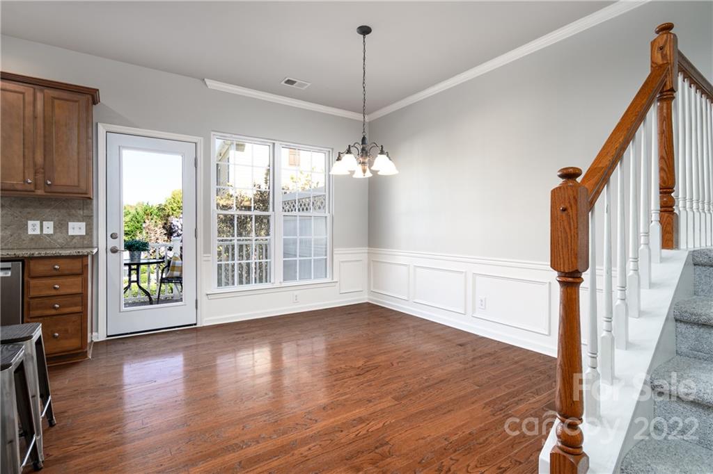 669 6th Baxter Crossing Fort Mill, SC 29708 - Photo 10 of 39 a view of an empty room with wooden floor and a window