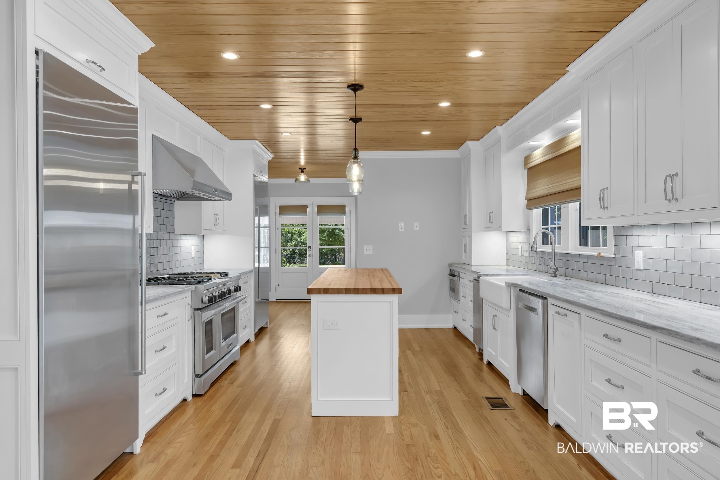 43199 Pine Grove Road Bay Minette, AL 36507 - Photo 36 of 71 Bright kitchen with hardwood flooring and a wood-panel ceiling