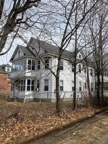 a view of a living room and dining room