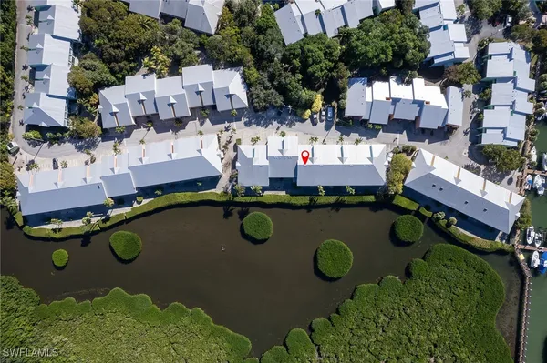 a bedroom with a bed and a tv on the dresser