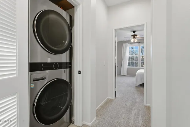 a view of a hallway with washer and dryer