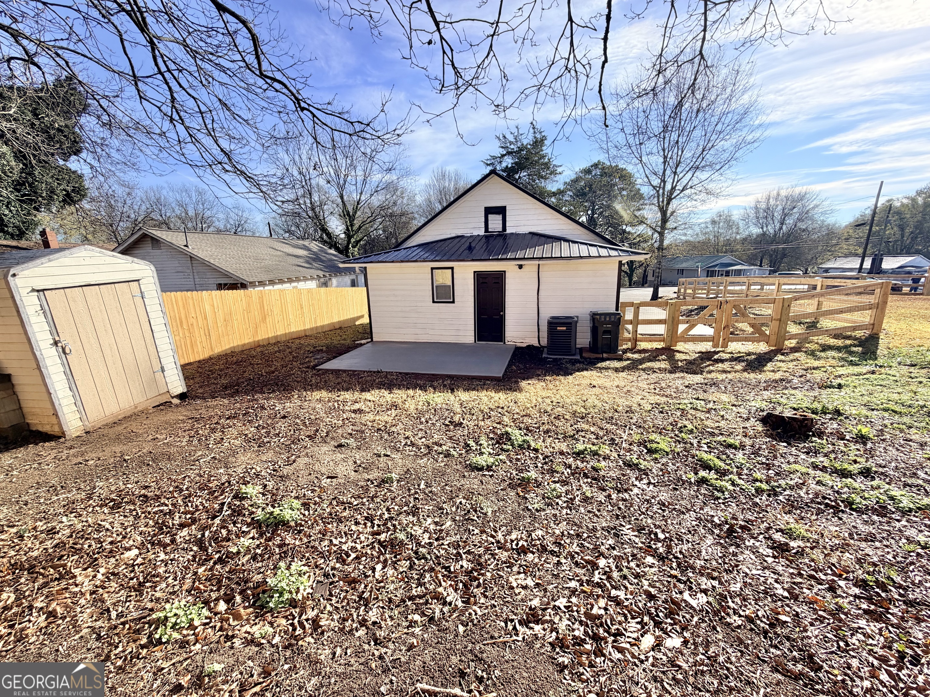 10 Busha Street Toccoa, GA 30577 - Photo 15 of 33 a front view of a house with a yard covered in snow